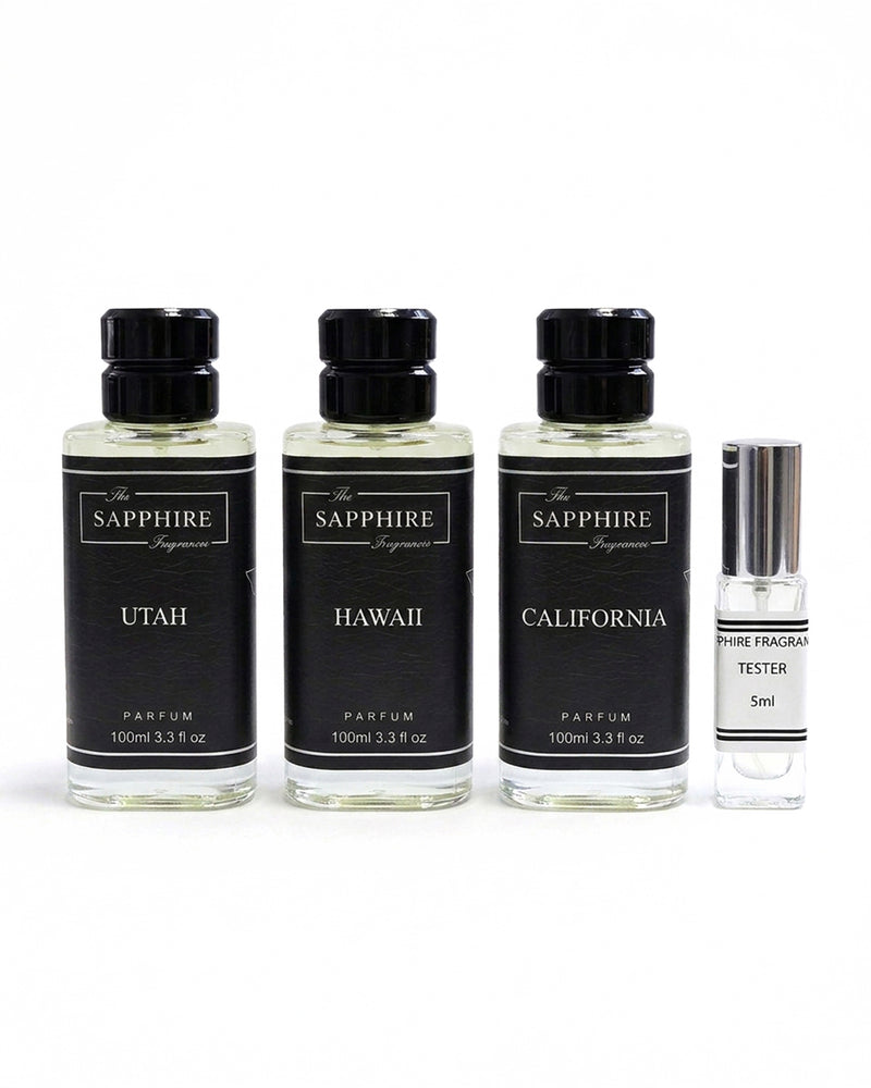 Three 100ml perfume bottles labeled Utah, Hawaii, and California, alongside a 5ml fragrance tester, all from The Sapphire Fragrance line, on a white background.