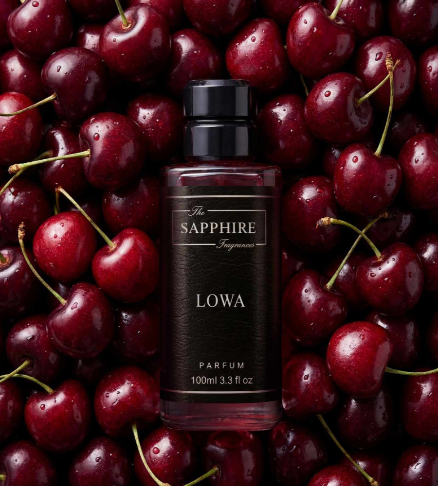 Bottle of Lowa Parfum surrounded by cherries